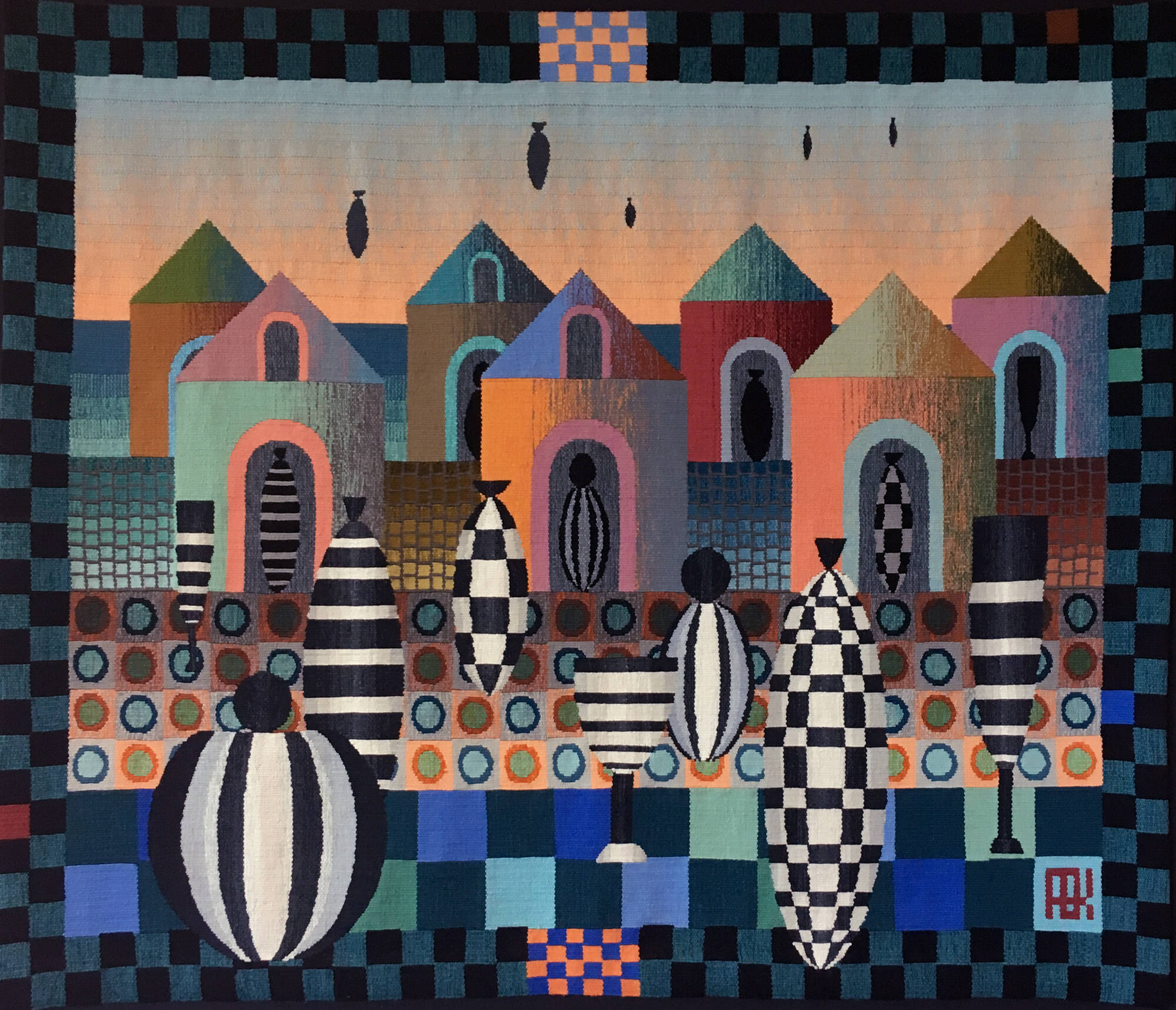Woven textile wall hanging with buildings and missles.
